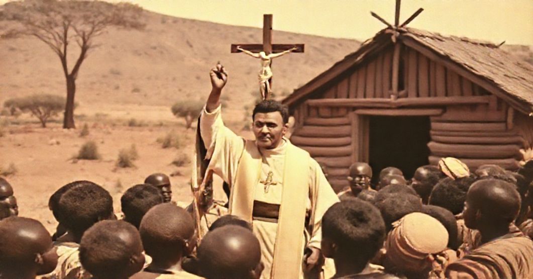 A solemn Catholic missionary scene in Bechuanaland with a Passionist priest and native converts under a crucifix.