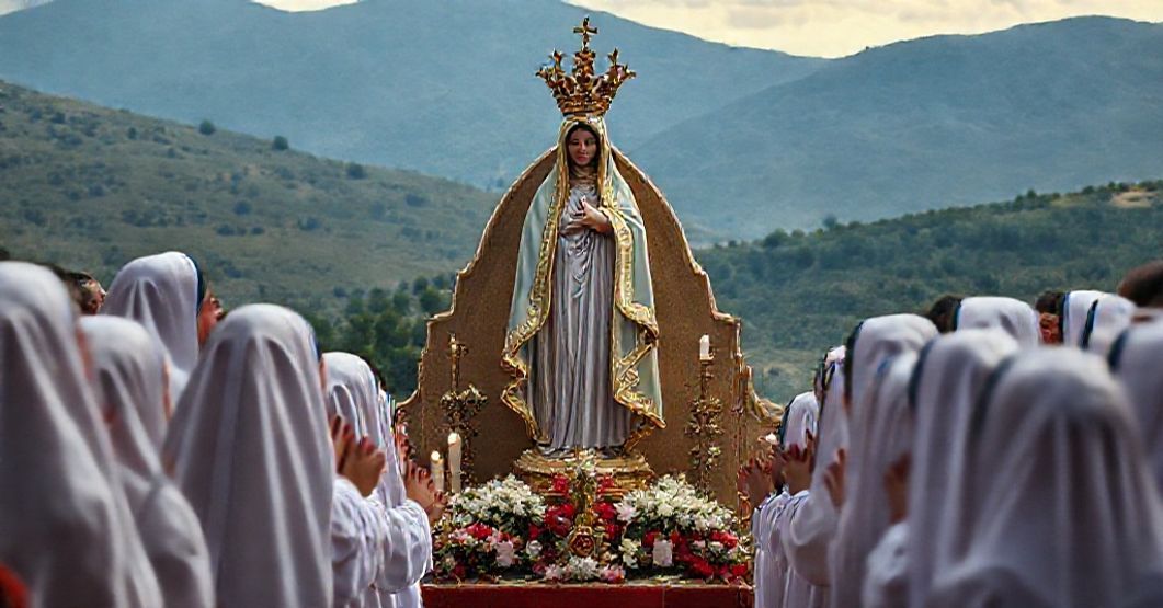 Nuestra Señora de El Soto Canonical Coronation A solemn depiction of the Marian shrine Nuestra Señora de El Soto in Iruz, Spain, during a canonical coronation ceremony. The image captures traditional Catholic devotion with the Virgin Mary's statue adorned with a golden crown.